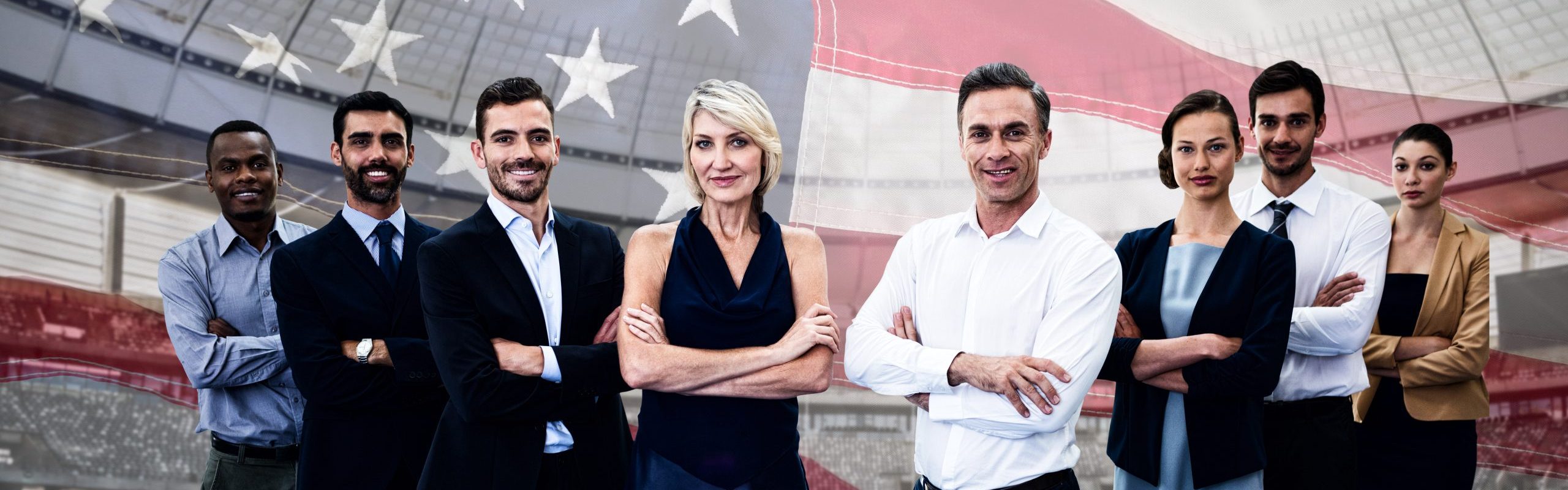 Diverse smiling business team against close-up of an american flag